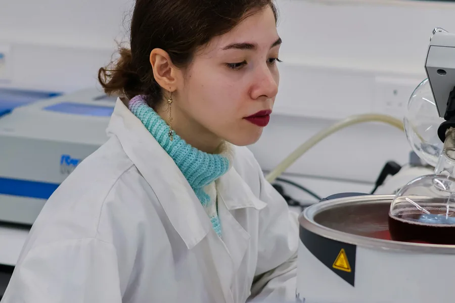 Laboratory professional operating specialised scientific equipment